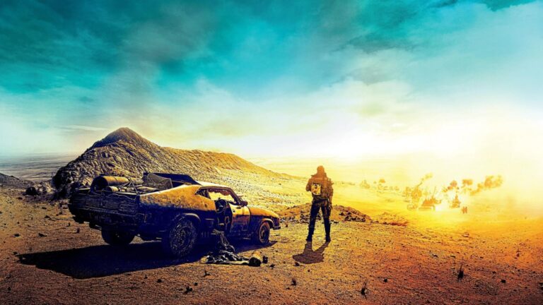 A lone figure stands beside a battered black muscle car on a rocky desert ridge, looking toward a distant convoy amid dust and a bright yellow horizon beneath a blue sky.